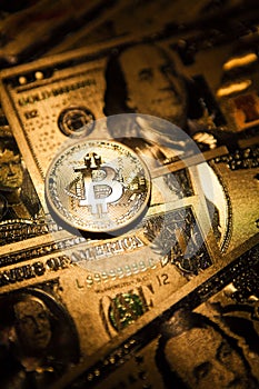 Bitcoin golden coin cryptocurrency on golden US dollar.