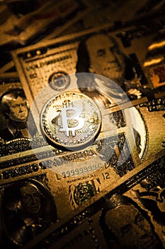 Bitcoin golden coin cryptocurrency on golden US dollar.