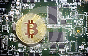 Bitcoin on green computer circuit board