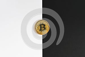 Bitcoin halving concept in cryptocurrency. Coin in black and white background.