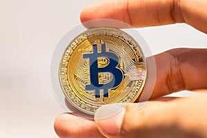 Bitcoin in hand,war of bitcoin,pull bitcoin with hand to hand, m