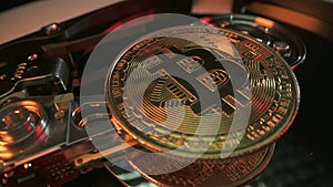 Bitcoin on hard drive disk as mining concept. Macro shot. Crypto currency Gold Bitcoin BTC Bit Coin close up of Bitcoin