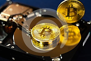 Bitcoin on hdd or harddrive, part of computer, cyber security concept, data privacy