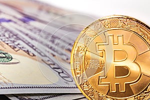 Bitcoin and hundreds dollars banknotes