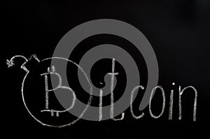 Bitcoin inscription with white chalk on a black board