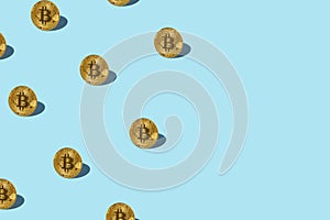 Bitcoin izometric pattern on bright light blue background.