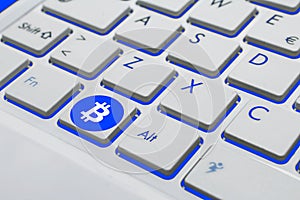 A bitcoin keyboard on blue and white