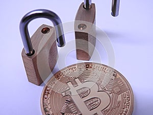 Bitcoin and brass padlocks