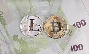 Bitcoin and litecoin on money background