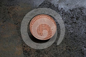Bitcoin logo coinon rusty metal background