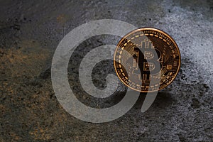 Bitcoin logo coinon rusty metal background