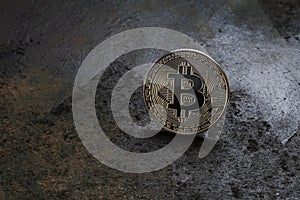 Bitcoin logo coinon rusty metal background