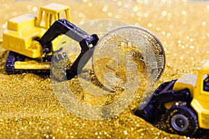 Bitcoin mining with gold glitter and construction vehicles