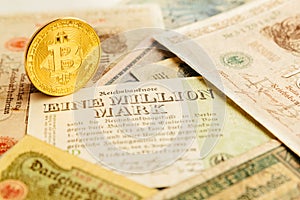 Bitcoin with old deutsch money. Inflation of paper money. Cryptocurrency concept background. Closeup with copy space.