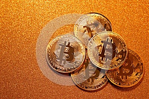 Bitcoin over golden glitter background. Business concept.