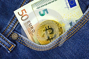 Bitcoin in pocket of blue jeans with Euro money, digital crypto currency coin, business and finance virtual money