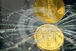 Bitcoin reflecting in broken glass, Cryptocurrency market crash concept, Bitcoin weakening, virtual currencies