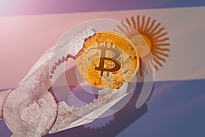 Bitcoin regulation in Uruguay; bitcoin btc coin being squeezed in vice on Uruguay flag background