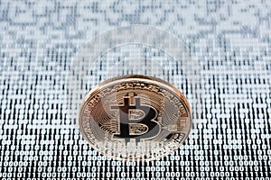 Bitcoin on binary code background