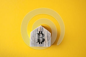 Bitcoin sign on the bright yellow background