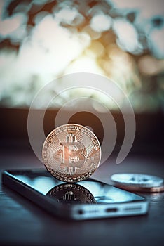 Bitcoin on smart phone with space for text,digital money online marketting concept