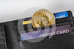 Bitcoin symbol cash for payment symbol cash with credit cards in a wallet