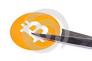 Bitcoin symbol, logo being cut in two with scissors, white background Halving, cutting price, going downwards