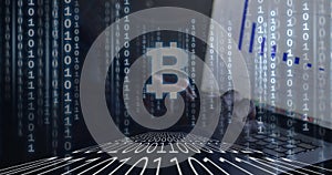 Bitcoin symbol over binary coding against hacker using computer