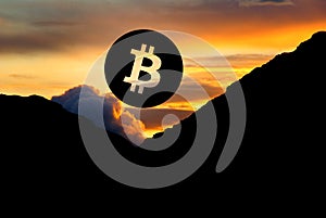 Bitcoin symbol in a scenic mountain sunset