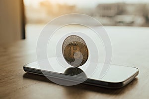 Bitcoin symbol on smartphone screen and cryptography concept