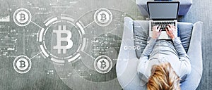 Bitcoin theme with man using a laptop