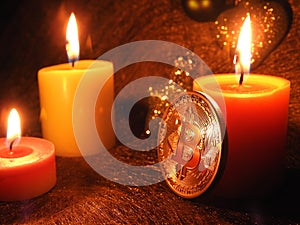Bitcoin and three candlelight`s