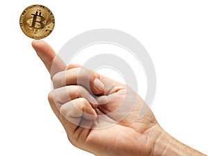 Bitcoin on tip of a finger. Holding wealth concept. Investing money into virtual currency for profit theme. Financial background