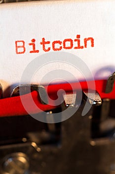 Bitcoin typed on typewriter on red