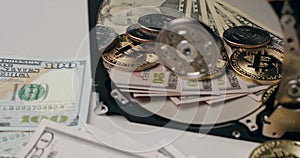 Bitcoin and US Dollar reflecting on Hard drive platter, cost of computer prices