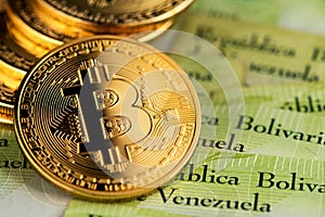 Bitcoin virtual money on Venezuela money Bolivar banknotes.