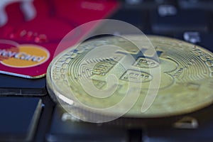 Bitcoin and Mastercard on keyboard