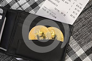 Bitcoin in a wallet at a restaurant