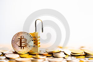 BitcoinBTC coin with padlock lying on coins stack.