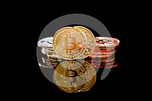 Bitcoins on a black background. Bitcoins and New Virtual money concept. Bitcoin is a new currency