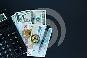 bitcoins - crypto currency next to calculator, pen on real money background. Internet e commerce, security, risk, investment, busi