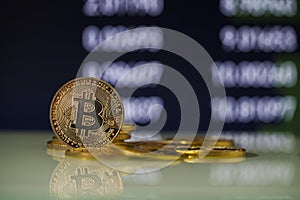 Bitcoins cryptocurrency coins with numbers in digital background