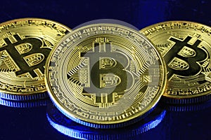 Bitcoins cryptocurrency money on a blue background