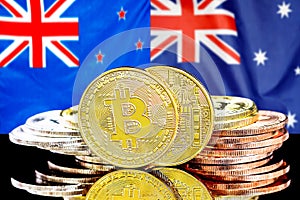 Bitcoins on New Zealand and Australia flag background