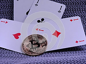 Bitcoins and playing cards - four aces photo