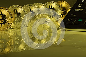 Bitcoins with reflection on marble desk. Electronic money, cryptocurrency