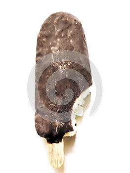 Bite ice cream covered by brown chocolate isolated on white background