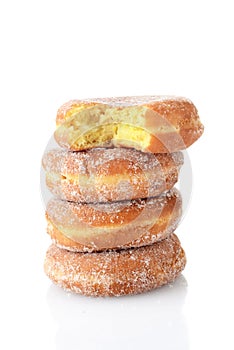 bite missing from stack of paczki donuts