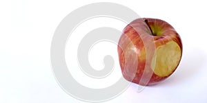Bite red apple on white background with copy space