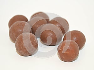 Bite size servings of unwrapped chocolate malt balls